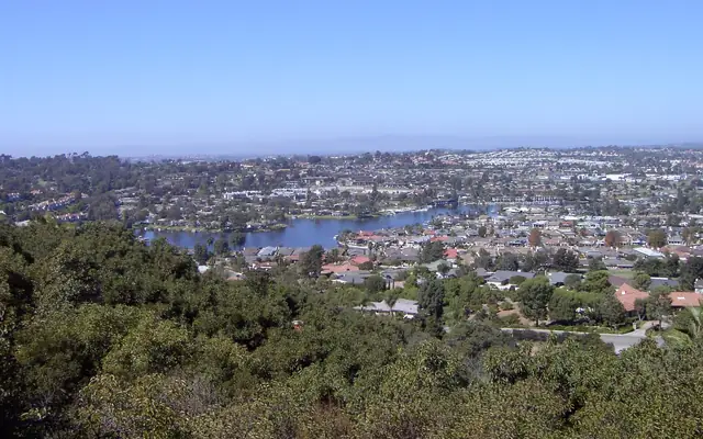 Homes and a lake in San Marcos seen from a hillside